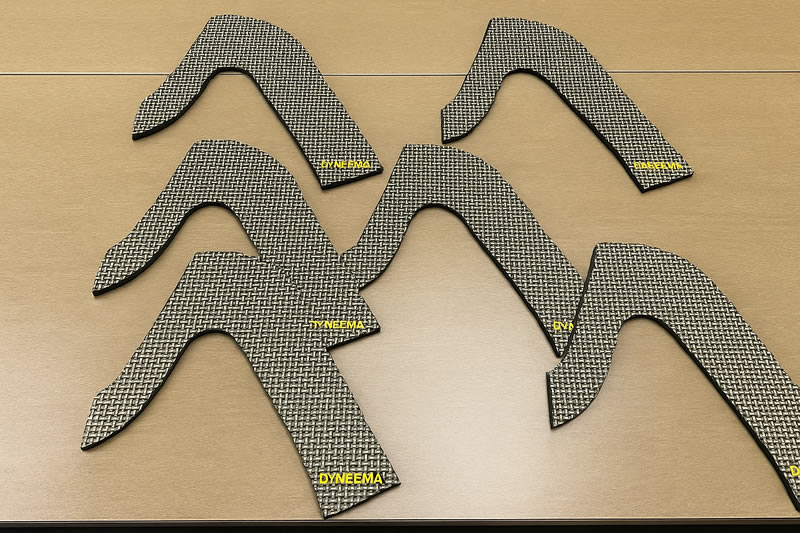 裁切完成的 Dyneema 防護件,曲線輪廓邊緣乾淨無毛邊